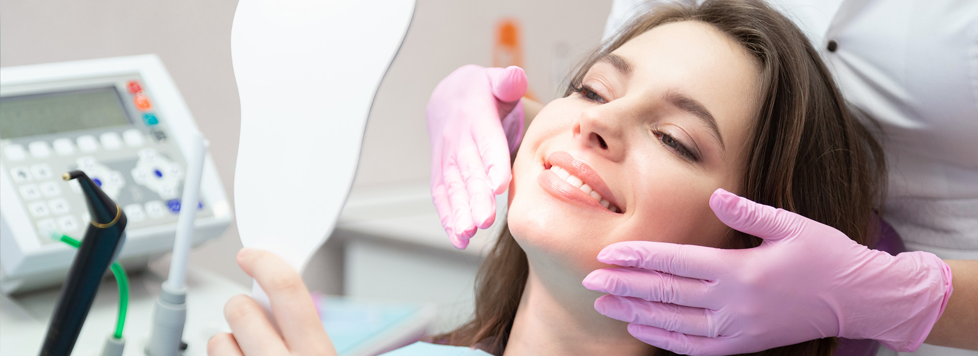 Woman receiving dental care with a smiling expression.